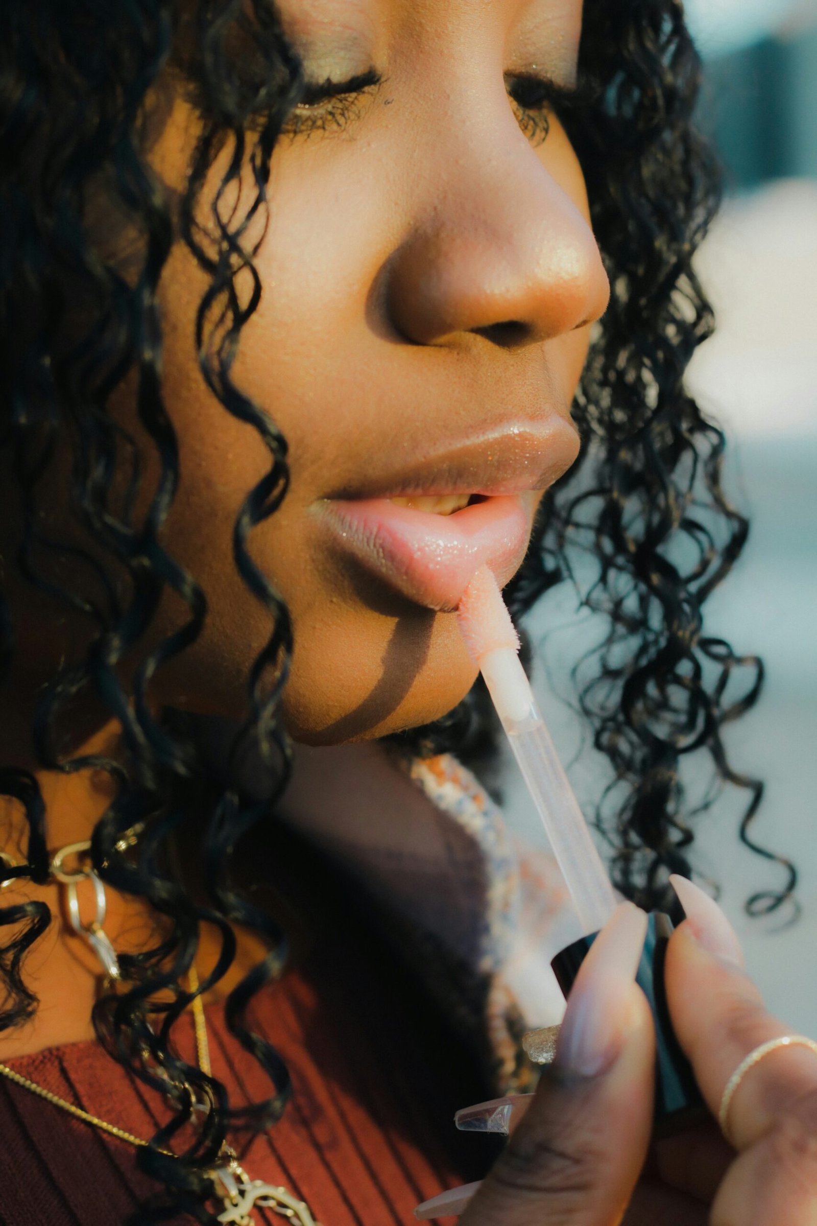 a close up of a person holding a toothbrush